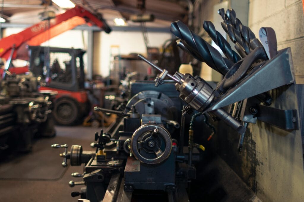 Machinery Close-up of a busy industrial workshop featuring machinery and tools.